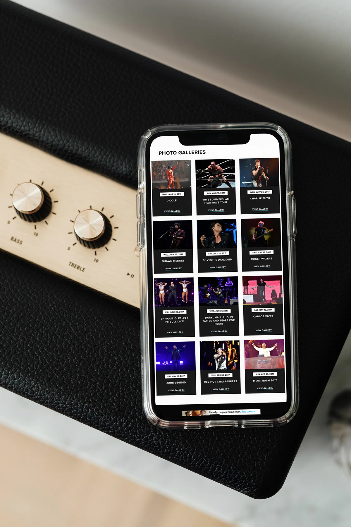 The arena website photo galleries page on a phone, showing a grid of event photos with dates, titles, and View Gallery links.